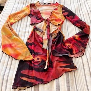 Jaded London cut out mini pixie dress in multi print long sleeve flared